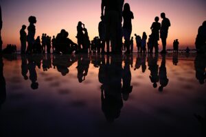 Silhouette picture of people with reflections